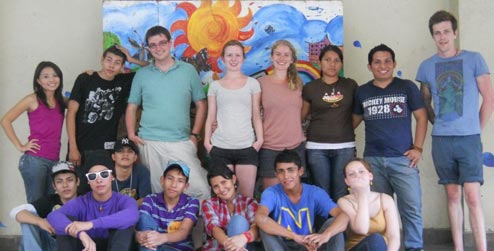 ICS Progressio volunteers with mural