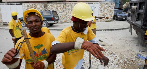 Workers clear rubble in Port-au-Prince Haiti
