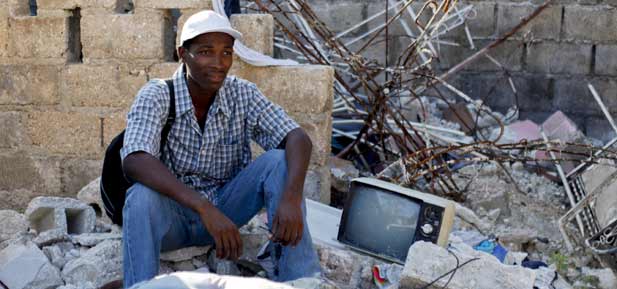 Jean Gaudy in the remains of his home