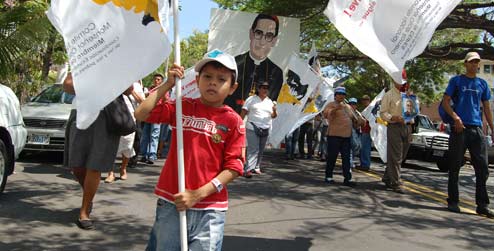 A child marching to commemorate Archbishop Oscar Romero in El Salvador