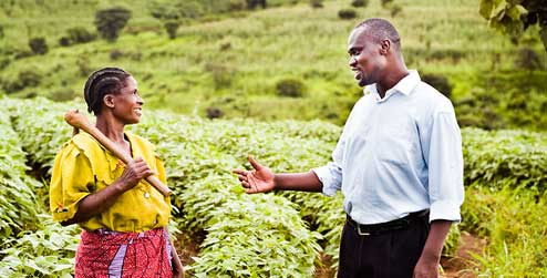 Development worker Innocent with Angelina, a farmer in Malawi