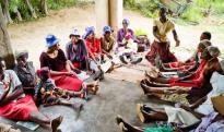 Gertrude Usaiwevhu talks to members of the women's volunteer group