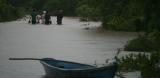People walking through flood in El Salvador