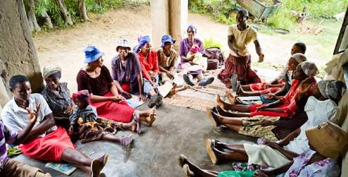 Gertrude Usaiwevhu talks to members of the women's volunteer group