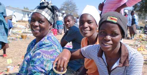 A group of farmers smile for the camera