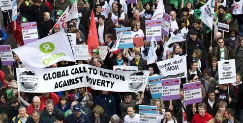 Protestors march to demand the government 'Put People First'