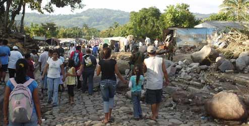 people walking amongst rocks and bolders