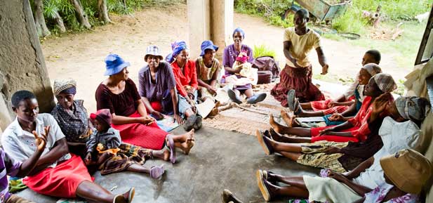 Gertrude Usaiwevhu talks to members of the women's volunteer group