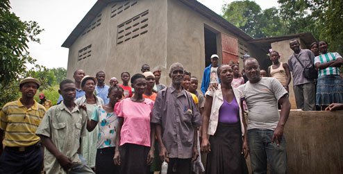 Villagers outside the cassava processing factory