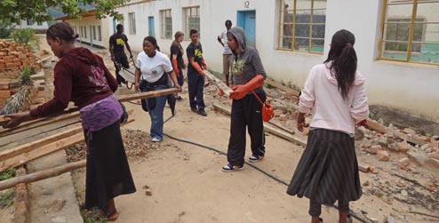 Volunteers fixing school