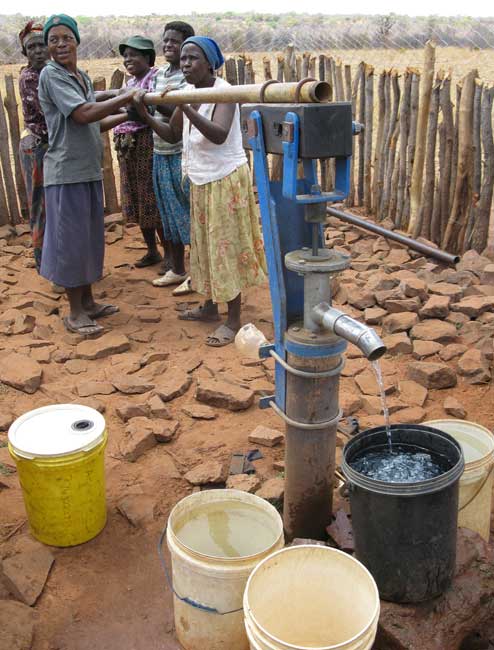 Women pumping water in Zimbabwe