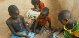 Kids in Malawi playing cards
