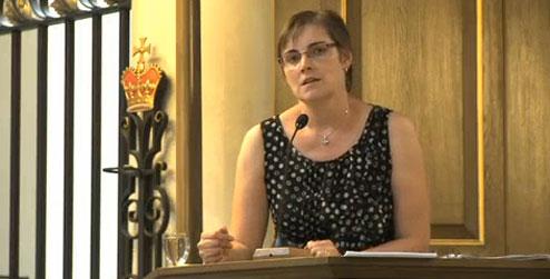 Christine Allen speaking at the JustShare debate (image from live video clips)