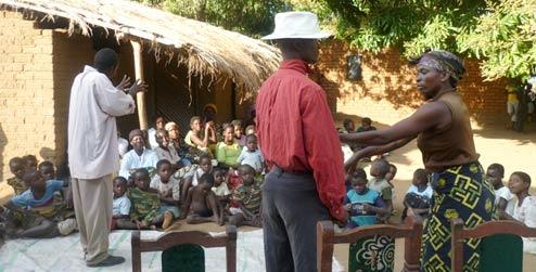 Children in Malawi village watch drama about HIV