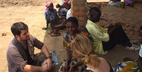 ICS volunteers talking to villagers in Malawi