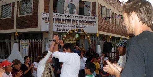 People dancing to celebrate the anniversary of the health clinic