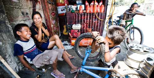 kids at a bike repair workshop in Dili