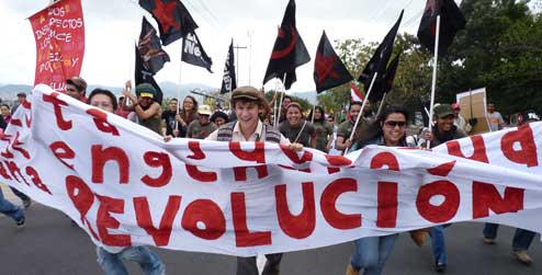 Young Hondurans demonstrating with a banner