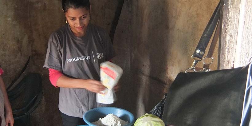 National volunteer Yakelin preparing the ingredients for the Enchiladas