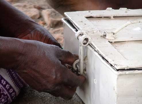 Women opening money box