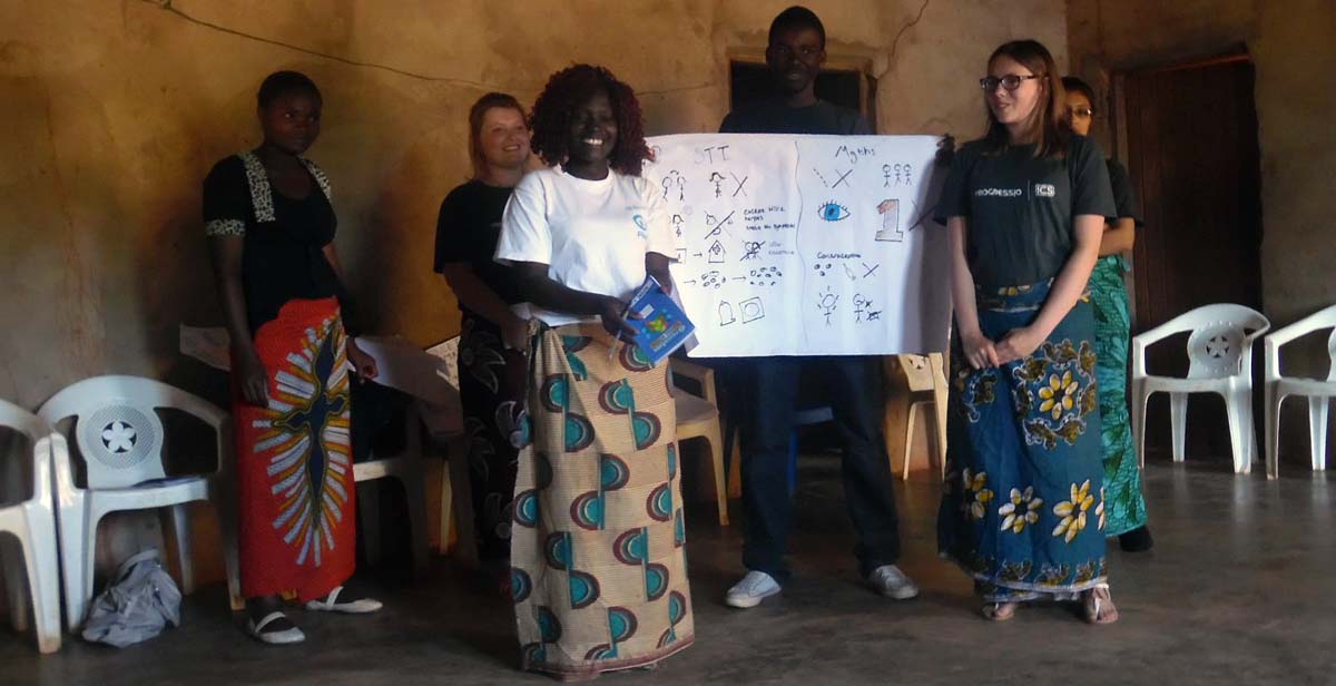 Female volunteers wearing the Chitenje while delivering a session