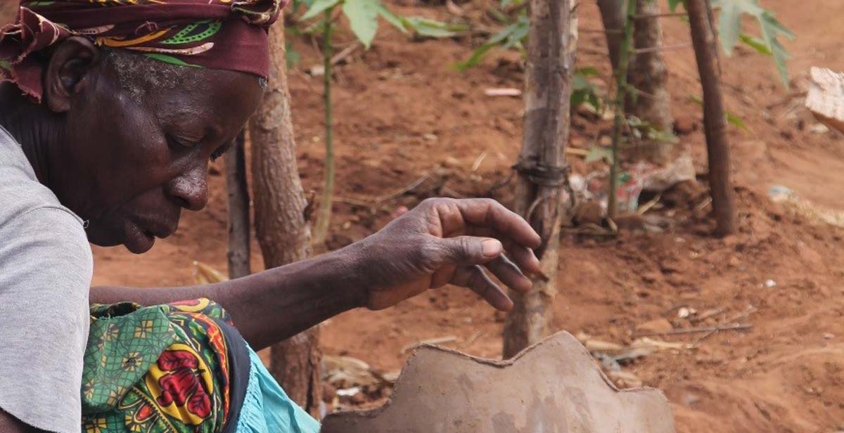 Micki making a clay pot