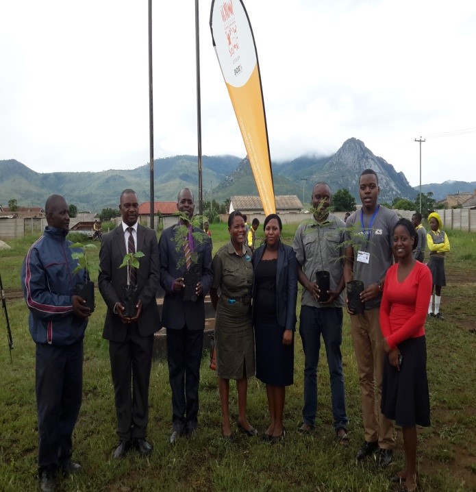 People responsible for setting up the event and for donating the trees pose for a photo