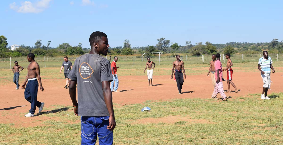Kudzai at a football event with local youth
