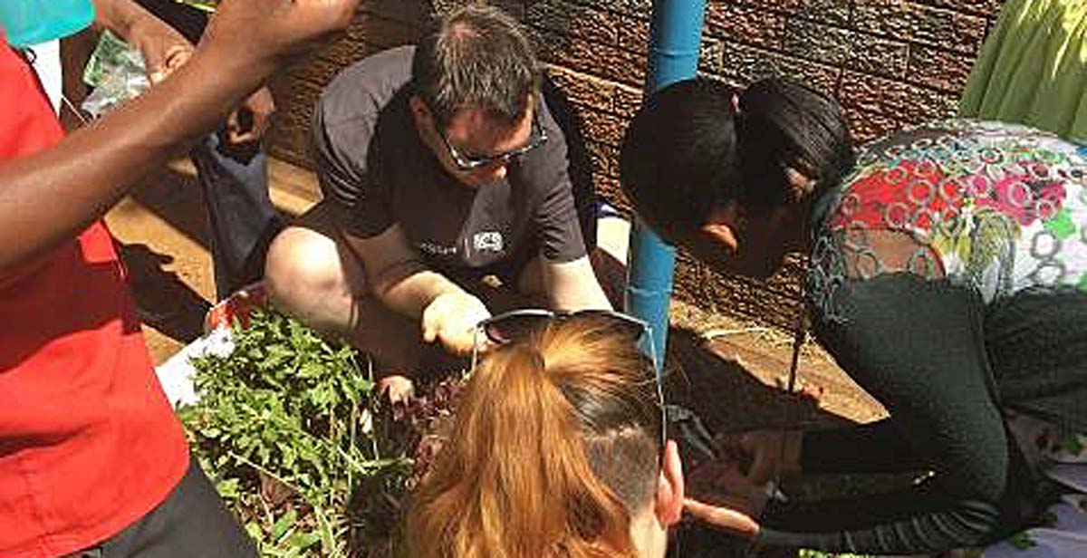 Planting vegetables during our gardening learning session