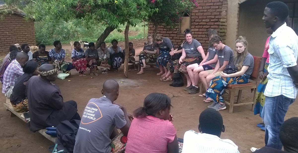 Volunteers meeting with village chief