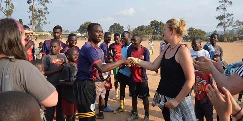 Emily congratulates the captain of Chibavi Rangers