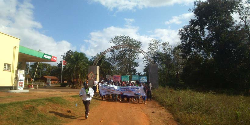 The procession leads into the field with the new members that joined along the way