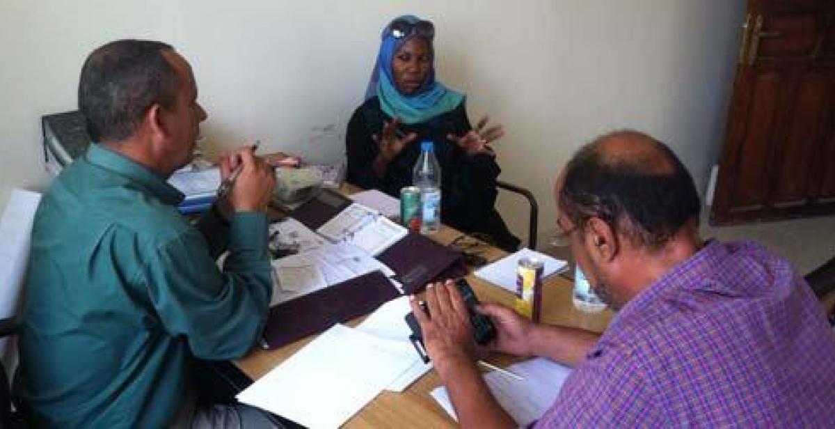 Sarah Kamya at a meeting with colleagues