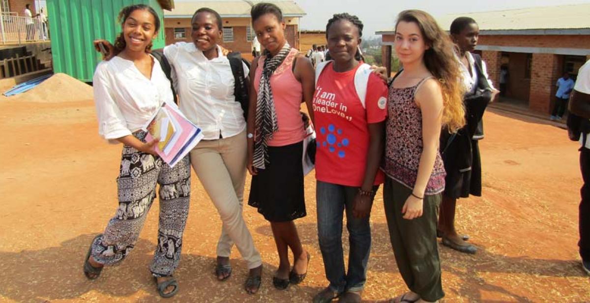 Volunteers Leah, Patricia, Tammie and Mphatso and Laura outside Masasa Secondary School following a successful peer education session