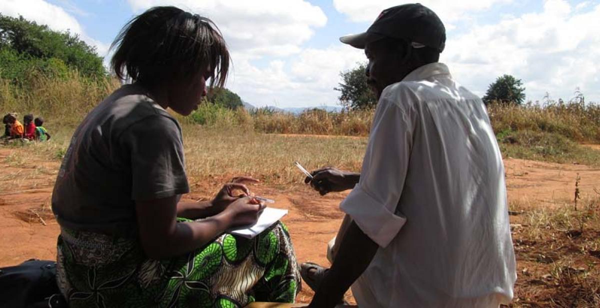 ICS volunteer Dorothy Mwalweni interviewing Mr. Raphael Nkosi 