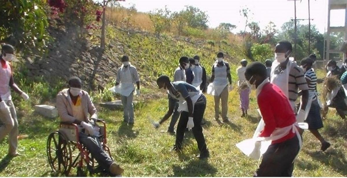 Volunteers help to clean up their local hospital in Malawi
