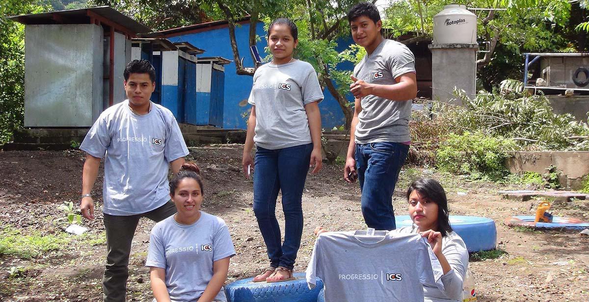 Michael (holding the t-shirt) with fellow ICS national alumni volunteering in the construction of the schools’ playground area