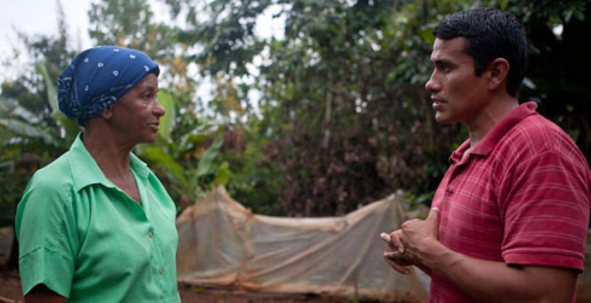 Amparo Jimenez and Bernardo Lopez in food garden