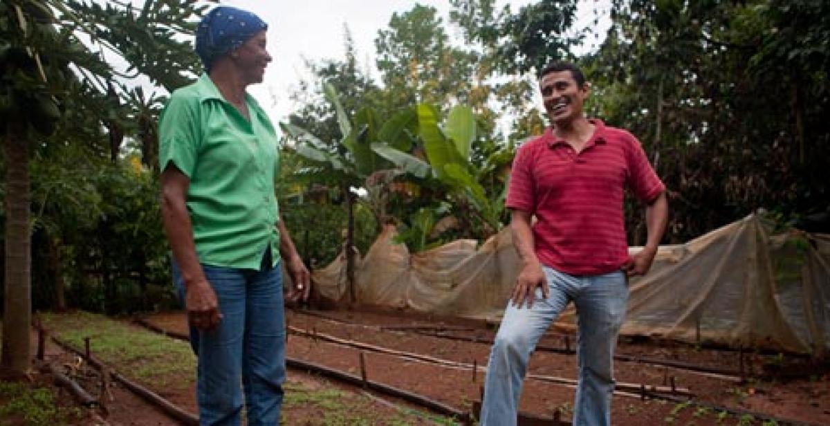 Amparo Jimenez and Bernardo Lopez in food garden