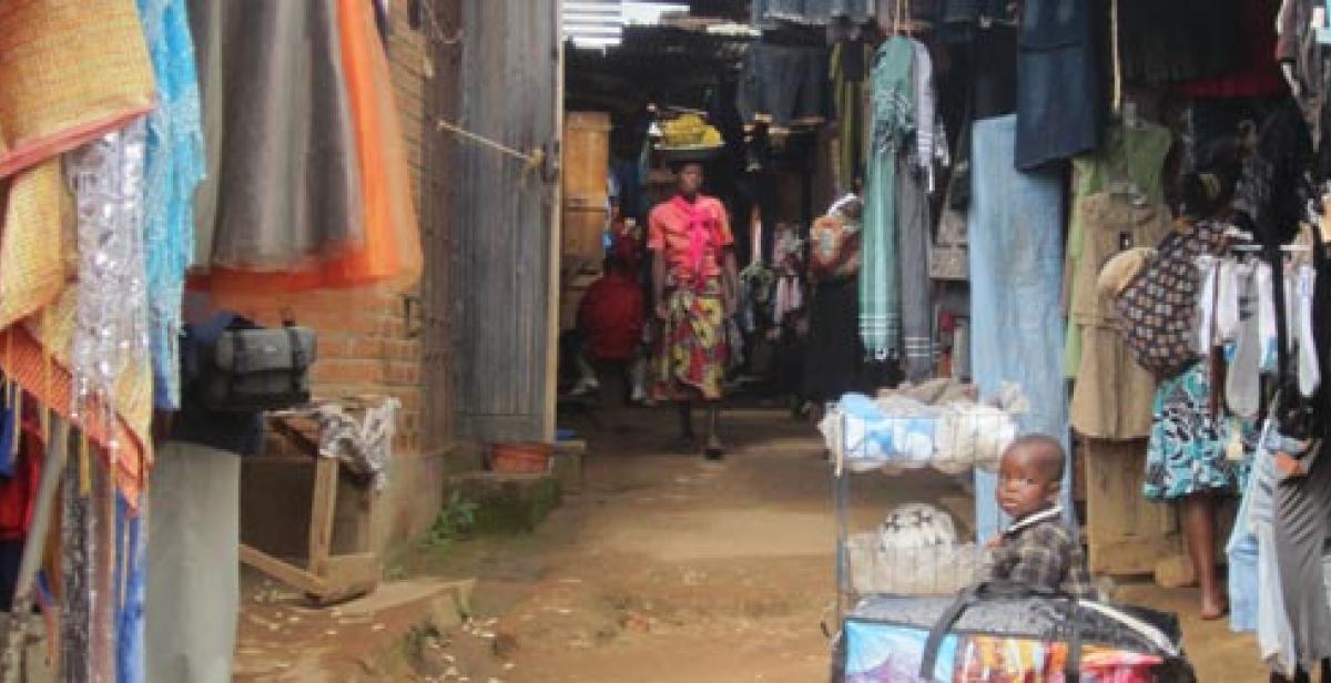 Woman and baby in clothes market