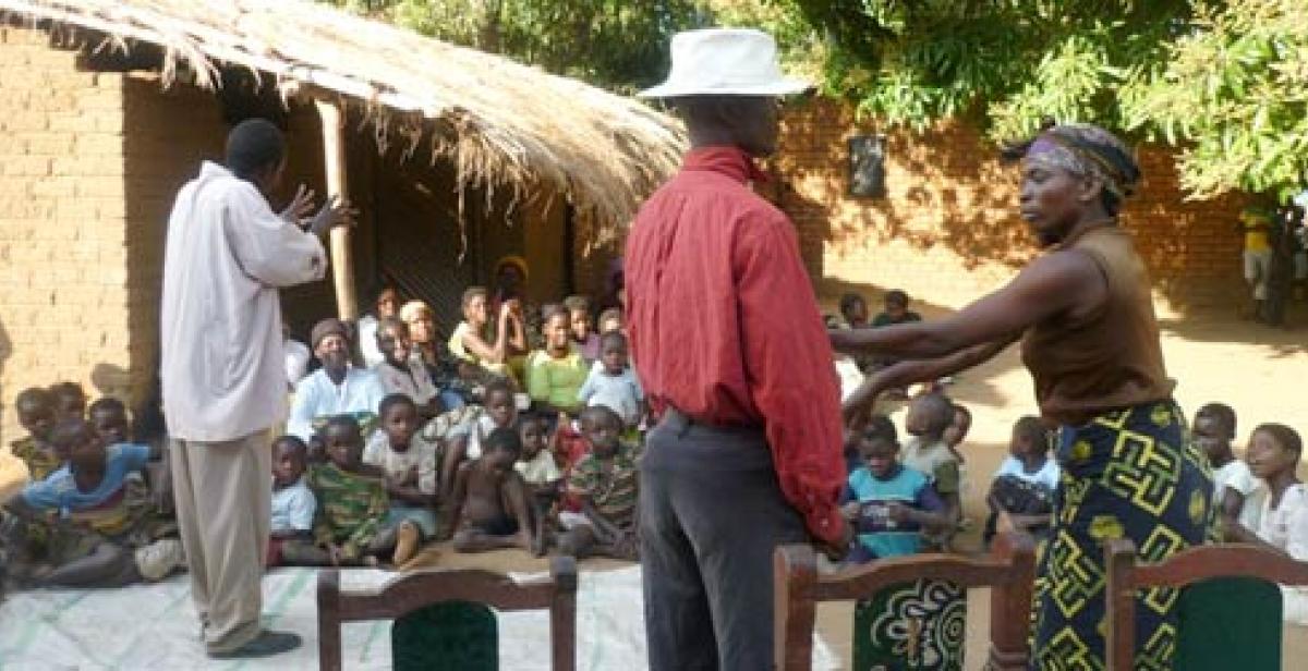 Children in Malawi village watch drama about HIV