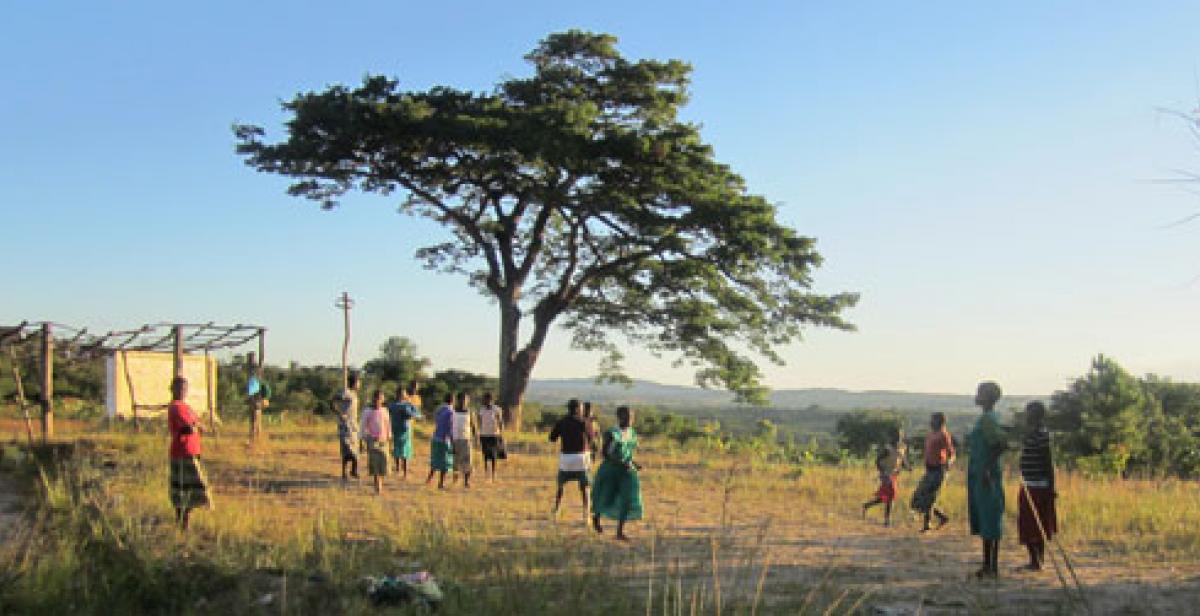 Girls playing in field in Mzimba, Malawi