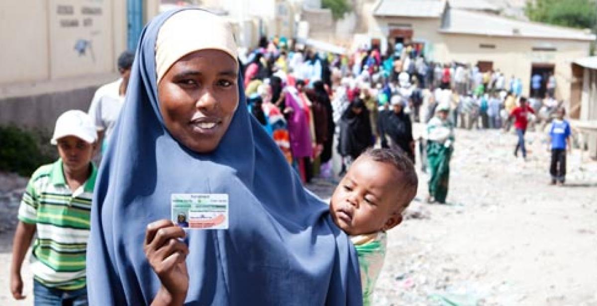 A woman in Somaliland holding her voting card on election day