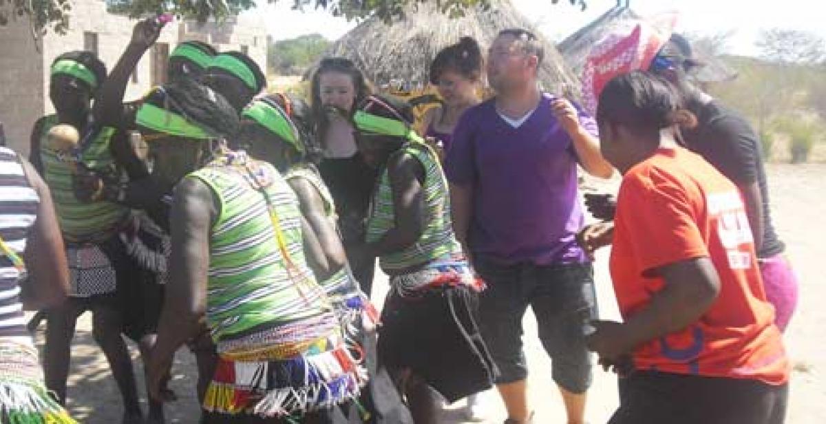 Volunteers dancing with the Lubu cultural dance group 