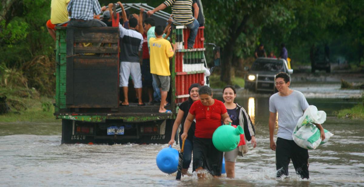 People wading through floods