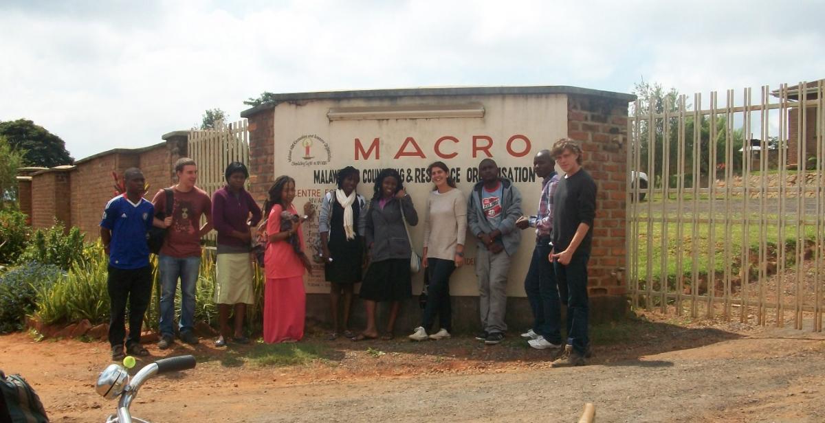 Volunteers standing outside the Malawi AIDS Counselling &amp; Resource Organisation