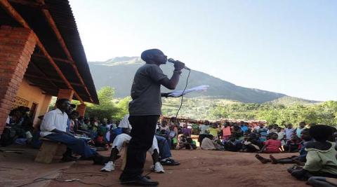  An ICS volunteer giving a speech about the importance of Labour Day