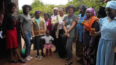 Sandra, from MASO, Amisa and Iona with the grannies, showing off their items