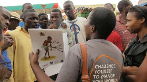 Patricia conducting a peer education session with bicycle taxi operators