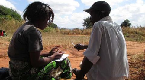 ICS volunteer Dorothy Mwalweni interviewing Mr. Raphael Nkosi 